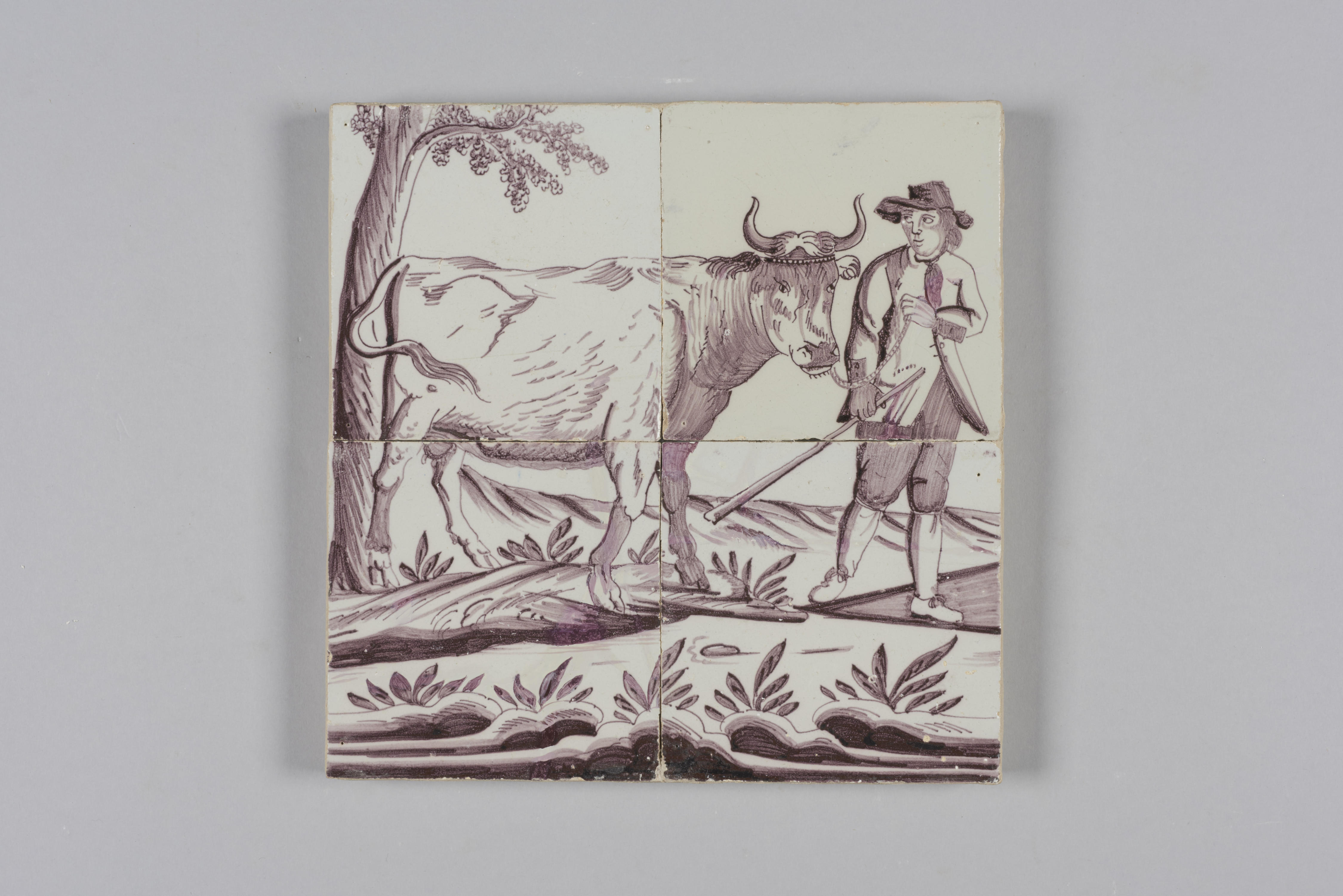 Tegeltableau met een afbeelding van een landschap met boer en koe, 1700–1800